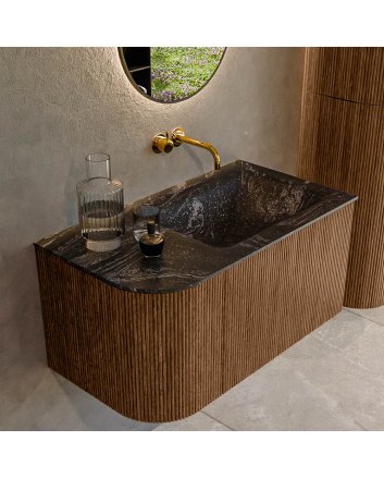 Mondiaz Kurve-Dlux 85cm badmeubel ronding Links kleur Walnut met 1 lade en 1 deur. Wastafel Cloud Rechts zonder kraangat Lava.