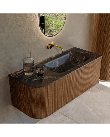 Mondiaz Kurve-Dlux 115cm badmeubel ronding Links kleur Walnut met 1 lade en 1 deur. Wastafel Big small Rechts zonder kraangat Lava.