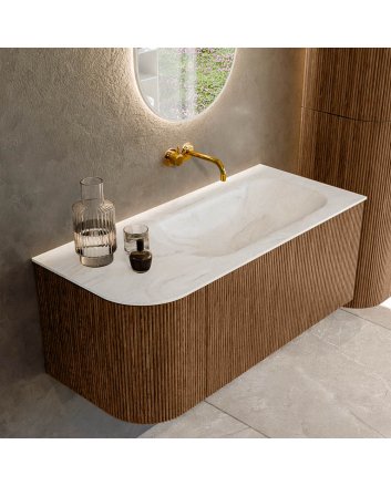 Mondiaz Kurve-Dlux 105cm badmeubel ronding Links kleur Walnut met 1 lade en 1 deur. Wastafel Big small Rechts zonder kraangat Ostra.