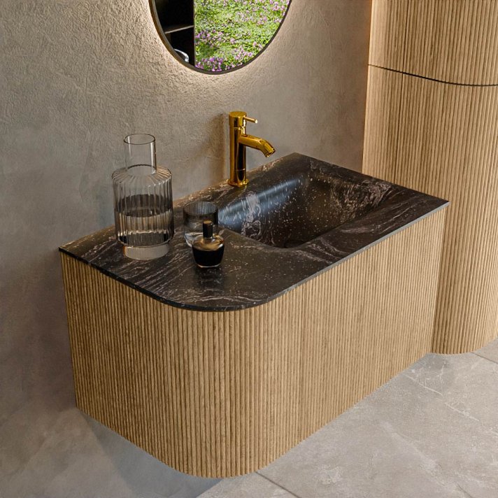 Mondiaz Kurve-Dlux 75cm badmeubel ronding Links kleur Oak met 1 lade en 1 deur. Wastafel Grunne Rechts 1 kraangat Lava.
